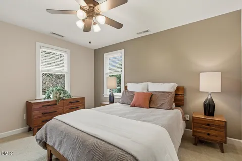 a white bath tub sitting in a bathroom next to a window