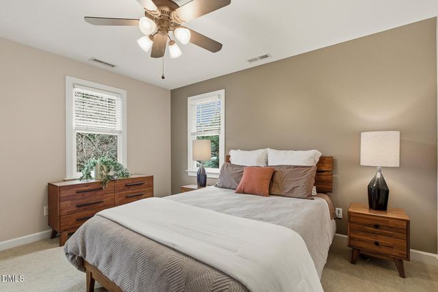 a white bath tub sitting in a bathroom next to a window