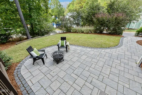 an aerial view of a house with a yard basket ball court and outdoor seating