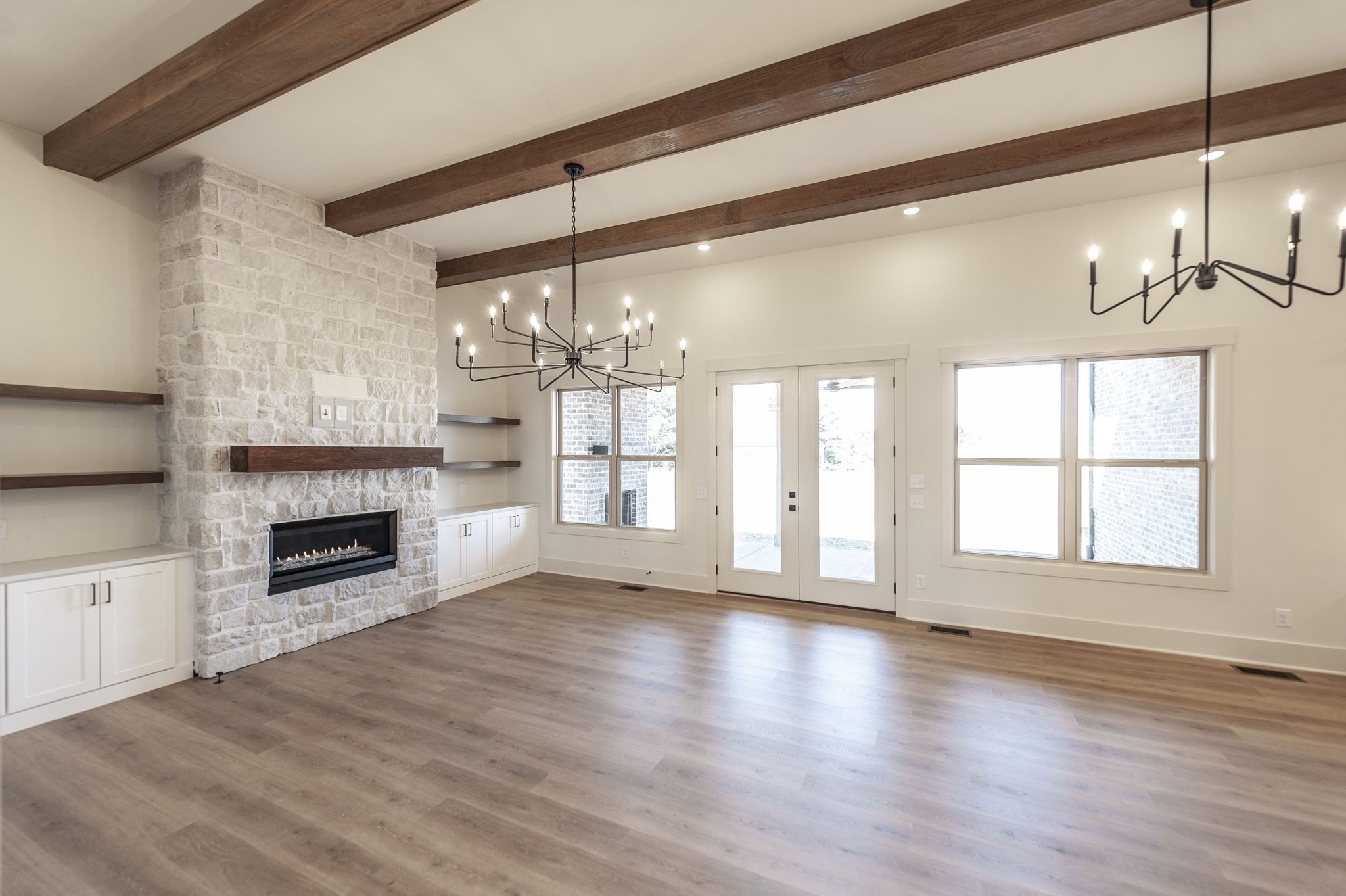 339 Raintree Drive Hendersonville, TN 37075 - Photo 21 of 53 a view of an empty room with wooden floor fireplace and a window