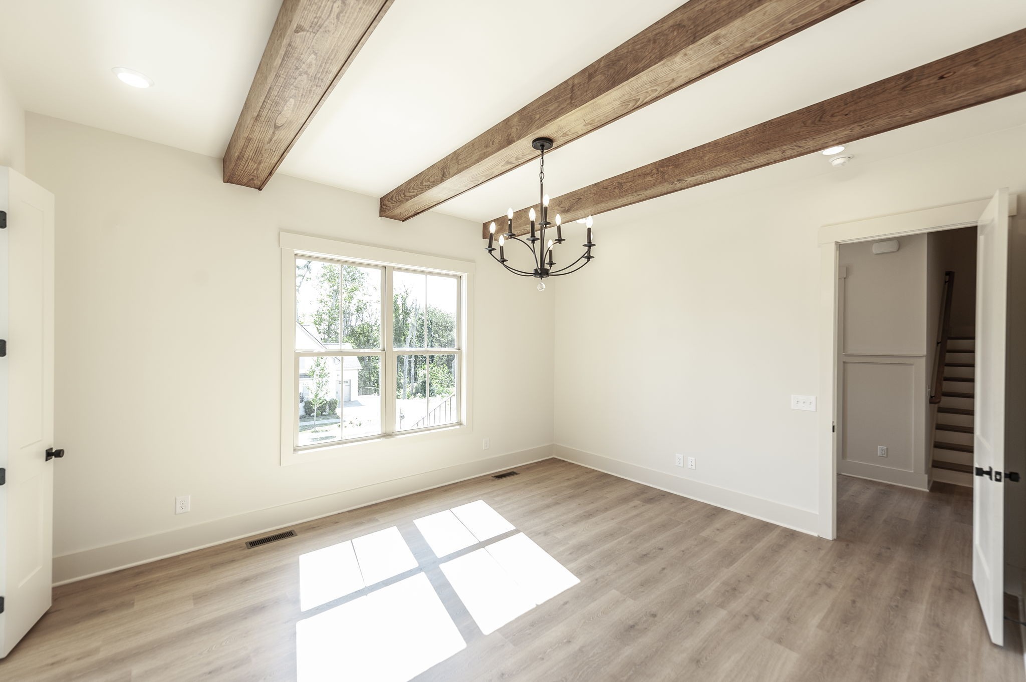 339 Raintree Drive Hendersonville, TN 37075 - Photo 34 of 53 an empty room with wooden floor fan and windows