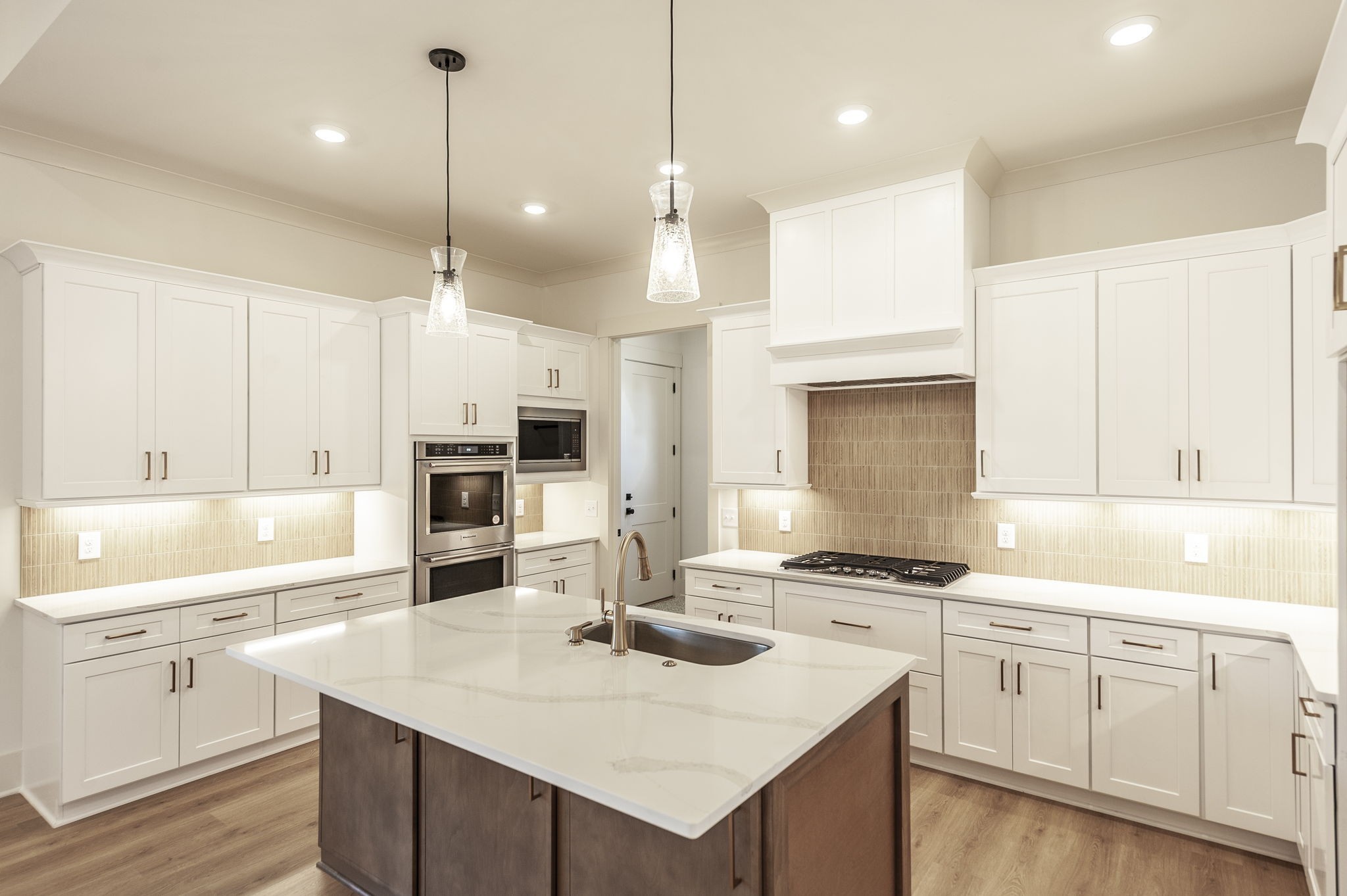 339 Raintree Drive Hendersonville, TN 37075 - Photo 40 of 53 a kitchen with a sink a stove a refrigerator and white cabinets
