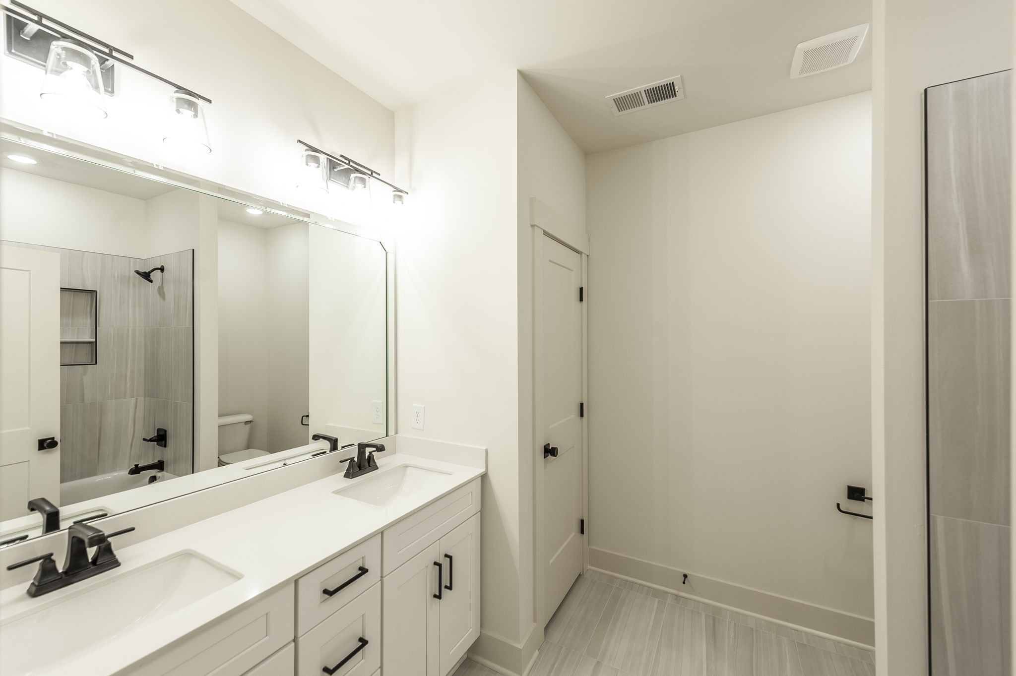 339 Raintree Drive Hendersonville, TN 37075 - Photo 52 of 53 a bathroom with a double vanity sink a mirror and a shower