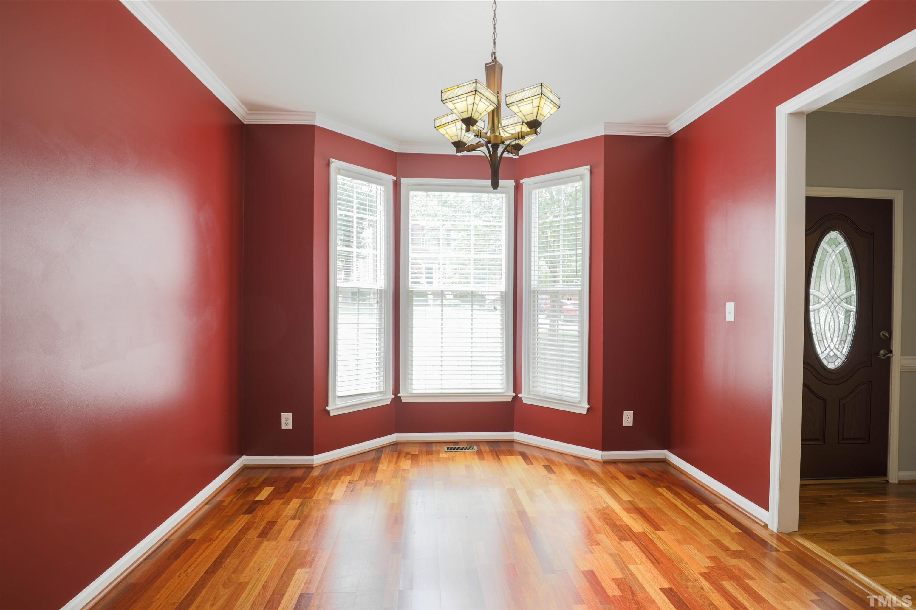 4709 Treadstone Court Raleigh, NC 27616 - Photo 12 of 22 a view of an empty room with window bathroom and front door
