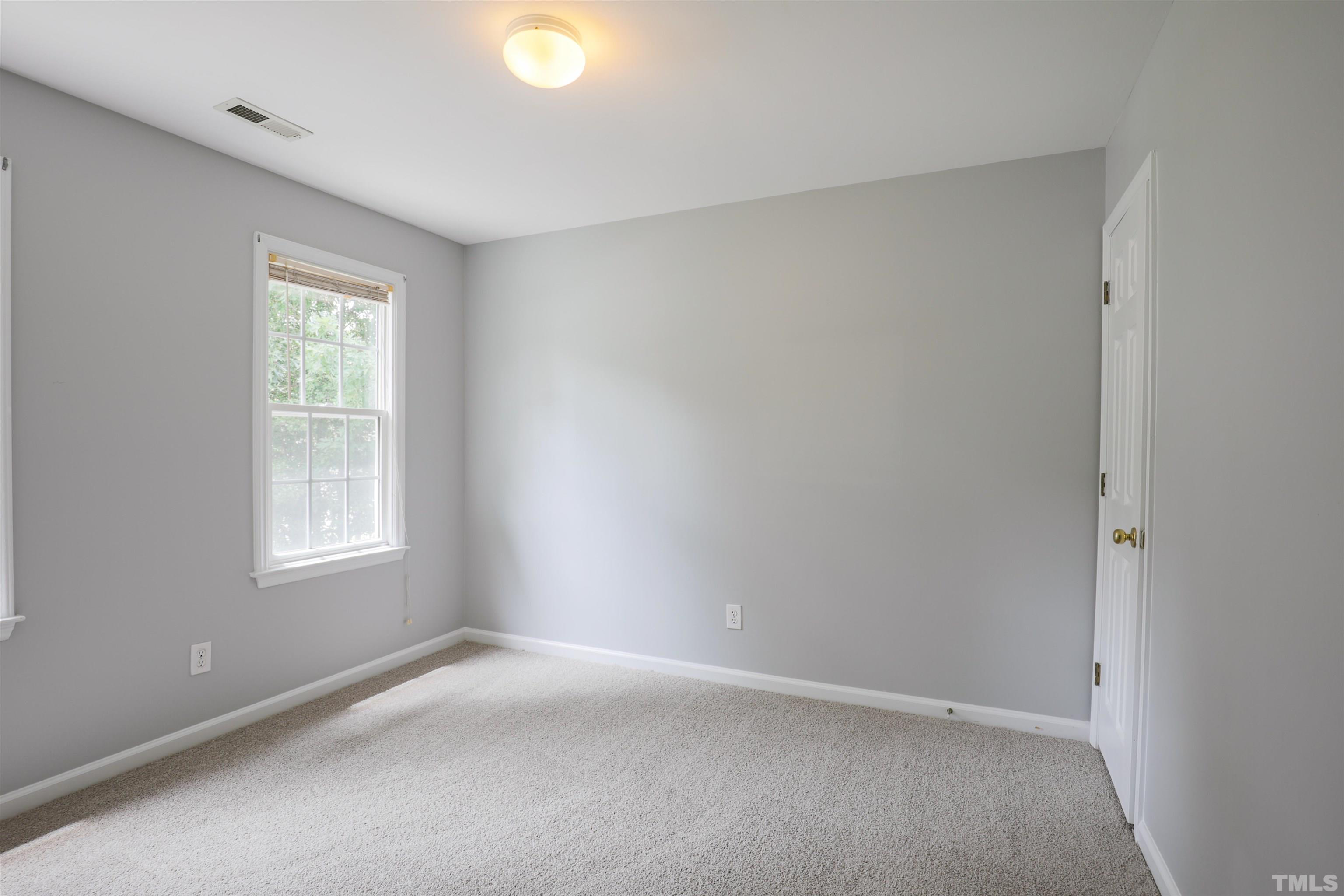 4709 Treadstone Court Raleigh, NC 27616 - Photo 16 of 22 an empty room with a window