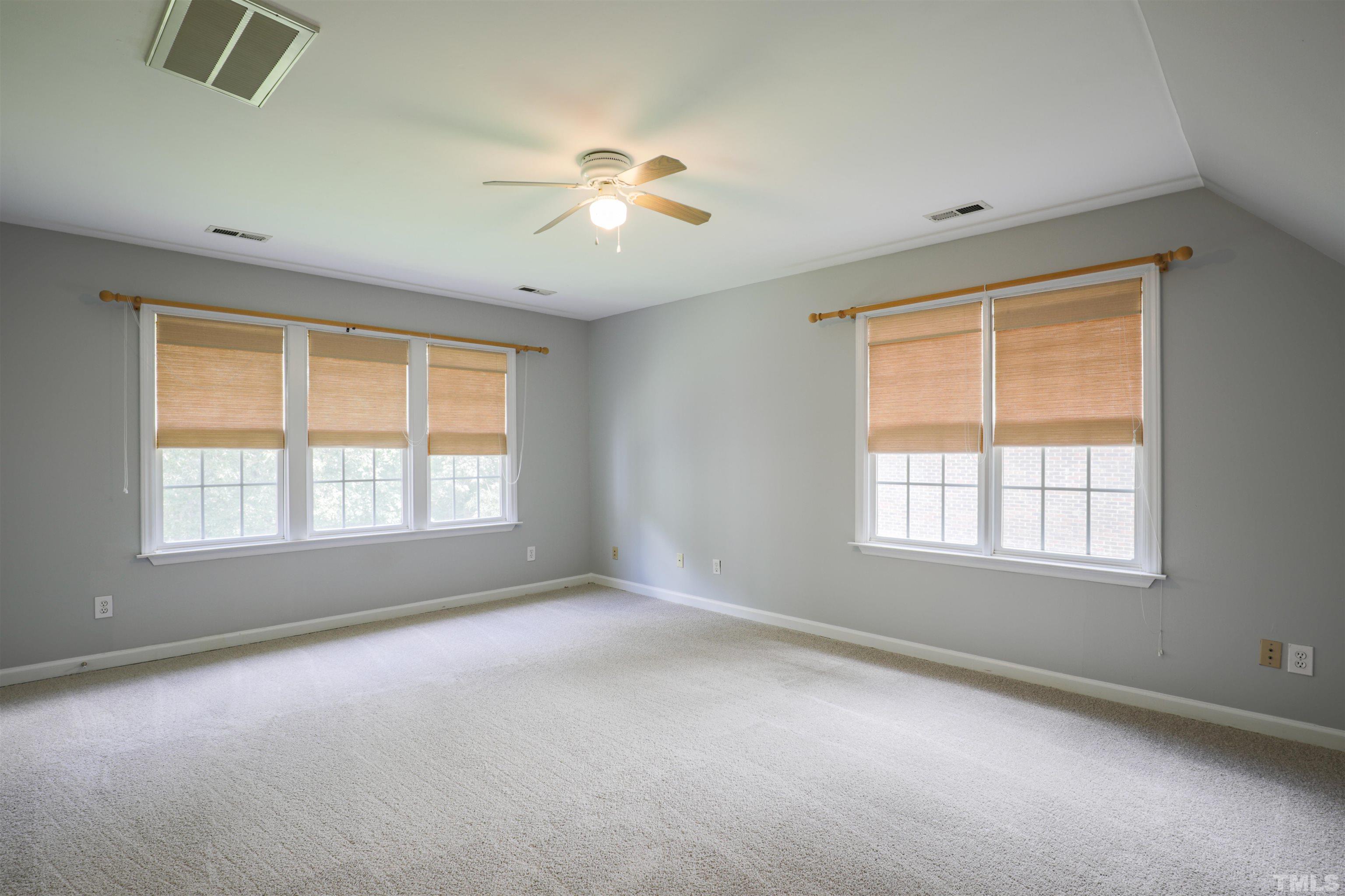 4709 Treadstone Court Raleigh, NC 27616 - Photo 18 of 22 a view of an empty room with a window