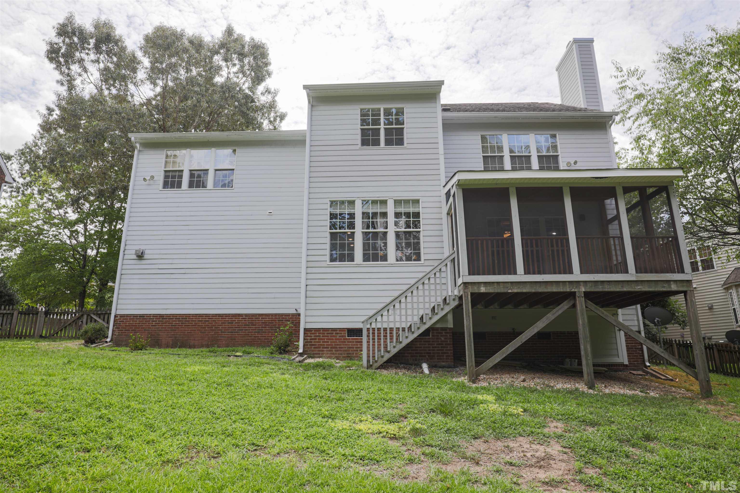4709 Treadstone Court Raleigh, NC 27616 - Photo 7 of 22 a view of a house with a yard and sitting area