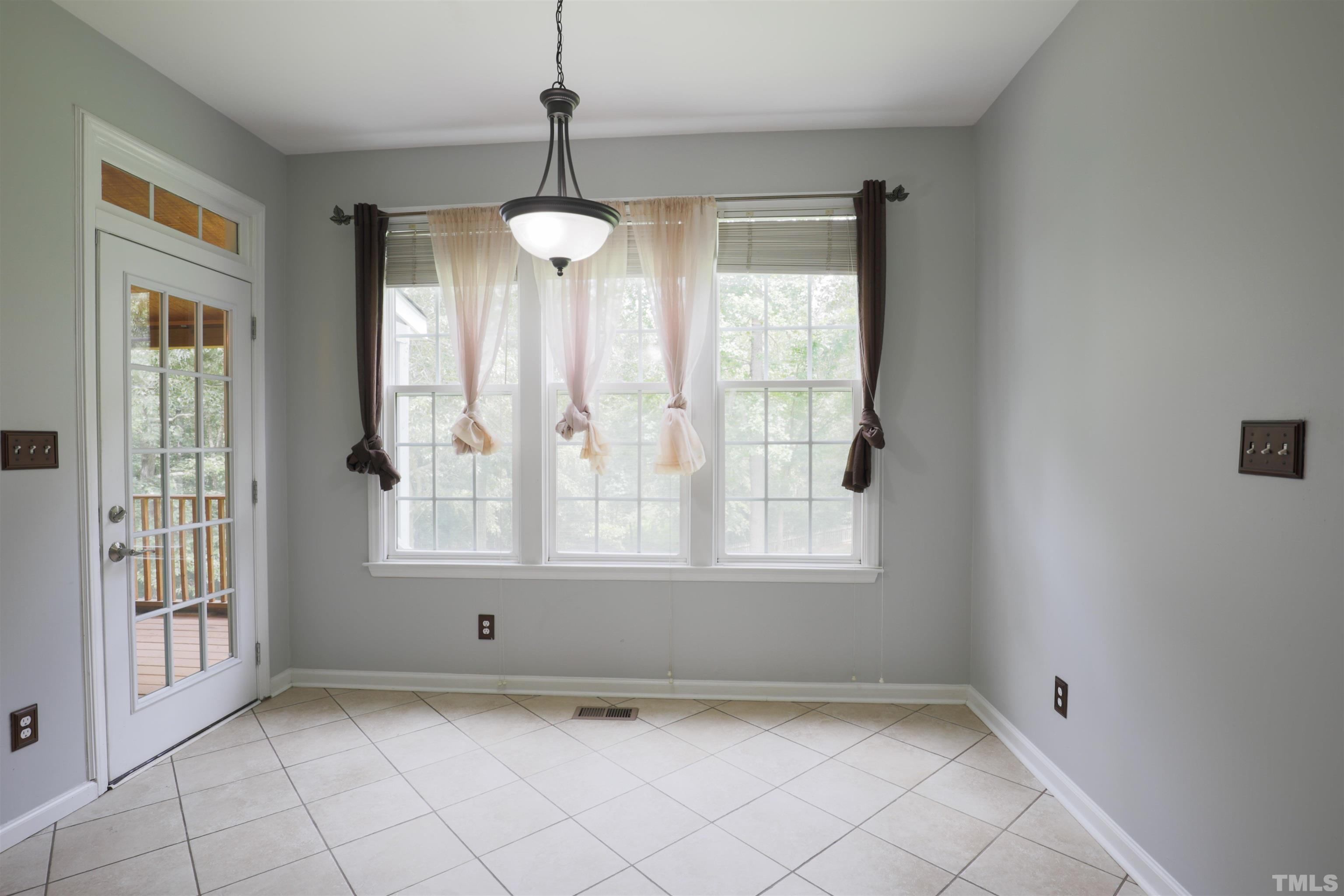 4709 Treadstone Court Raleigh, NC 27616 - Photo 10 of 22 a view of an empty room with a window