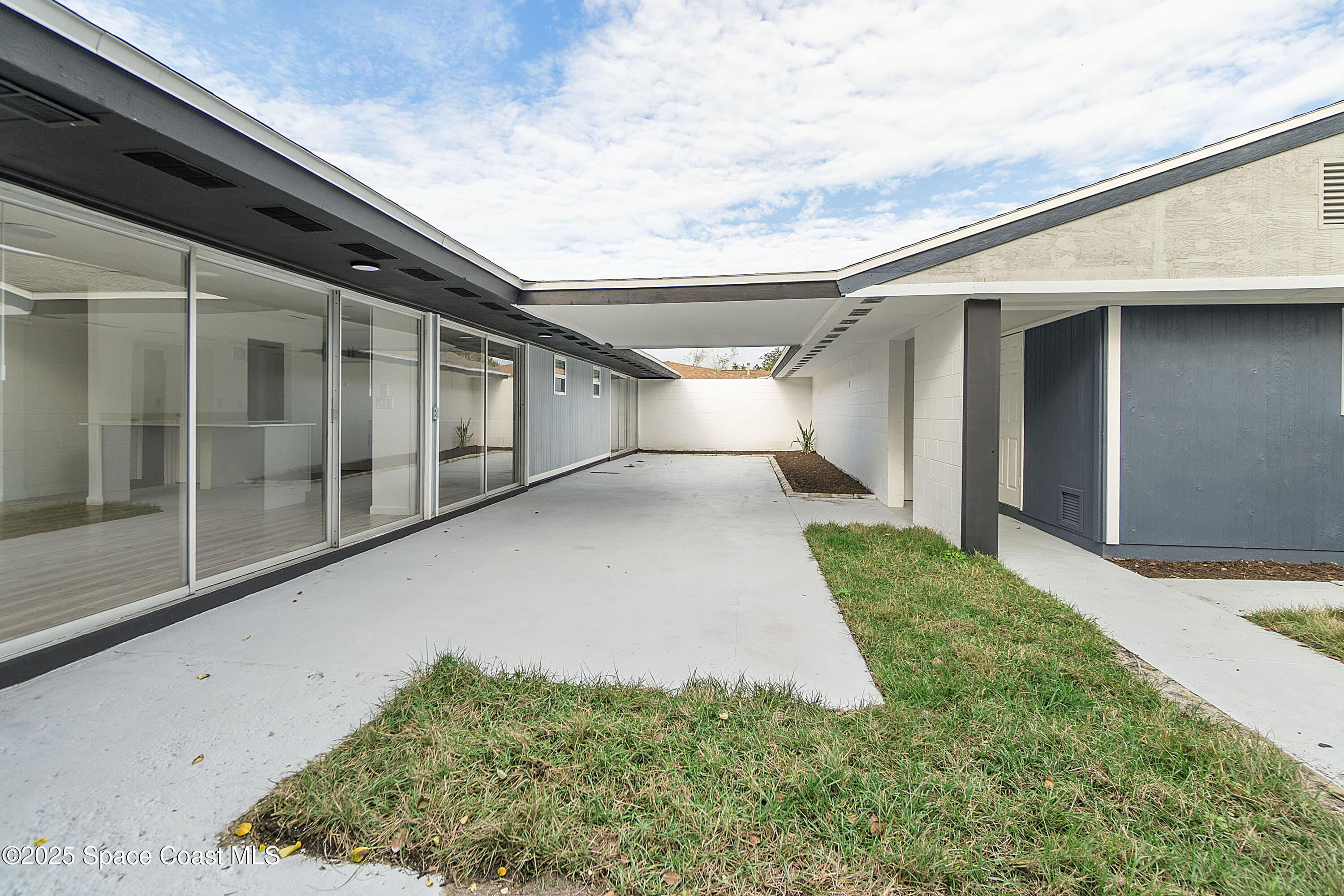 949 Levitt Parkway Rockledge, FL 32955 - Photo 15 of 52 a view of a back yard of the house