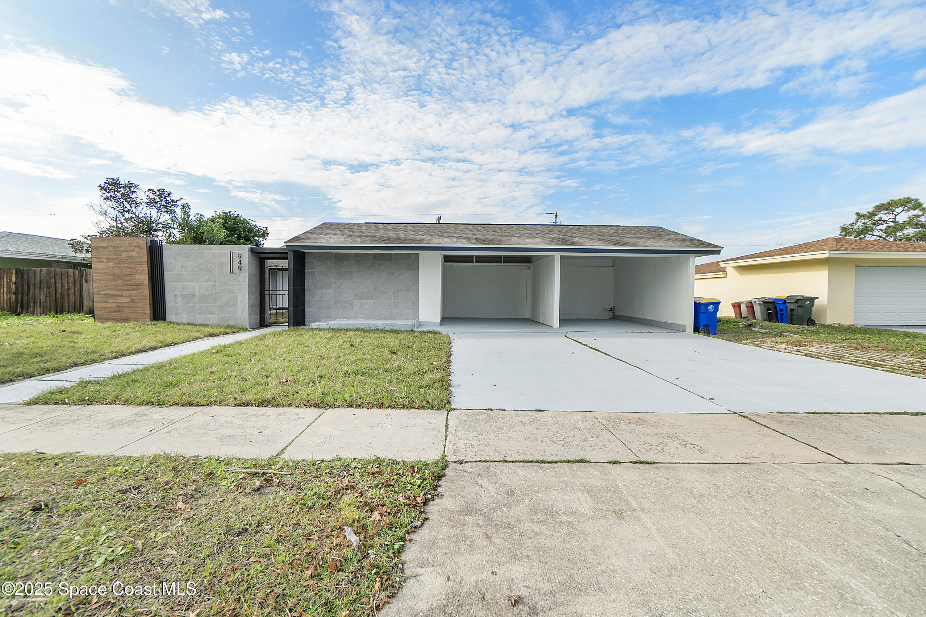 949 Levitt Parkway Rockledge, FL 32955 - Photo 17 of 52 a front view of a house with a garden