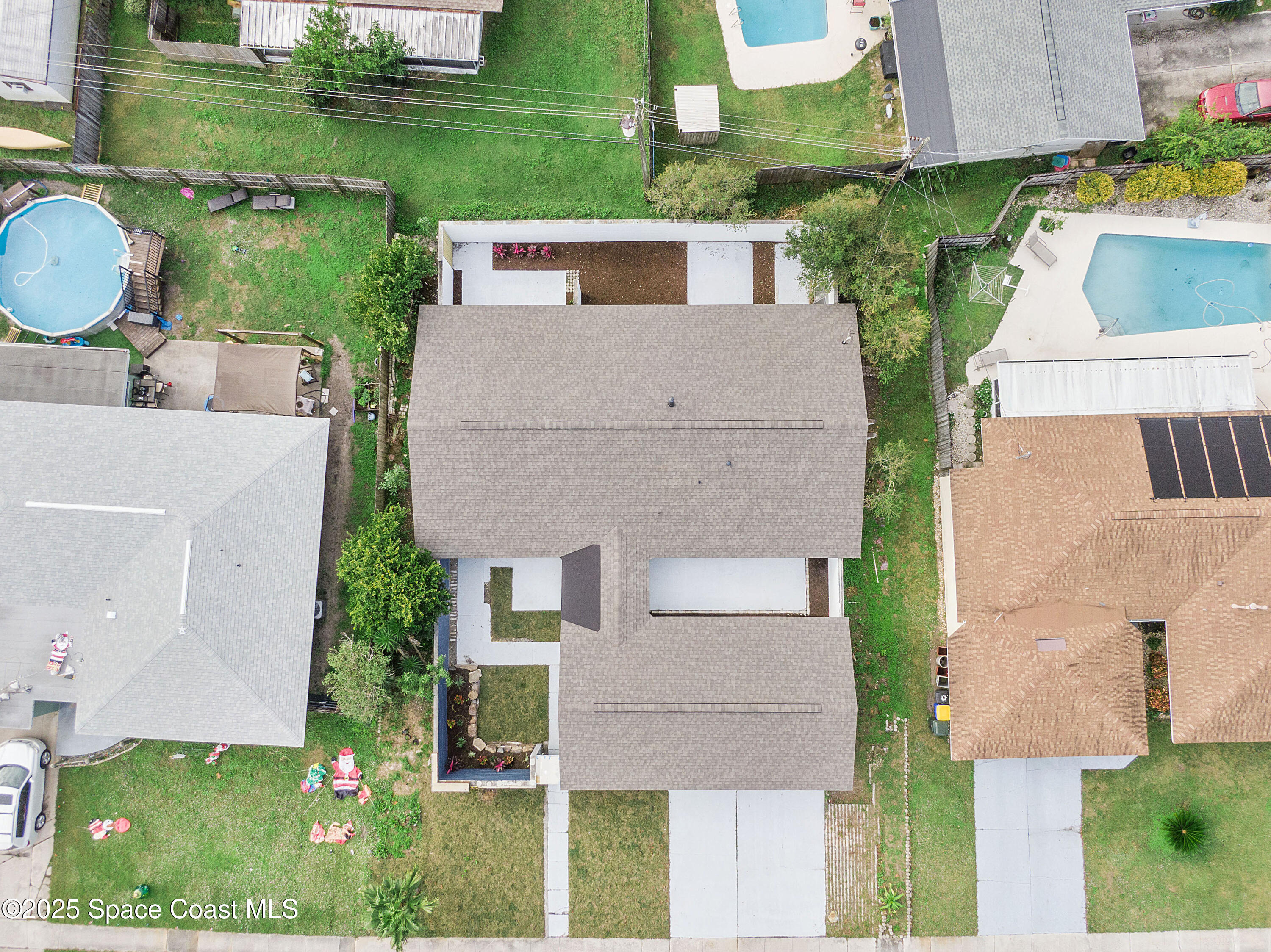 949 Levitt Parkway Rockledge, FL 32955 - Photo 2 of 52 an aerial view of a house with a yard