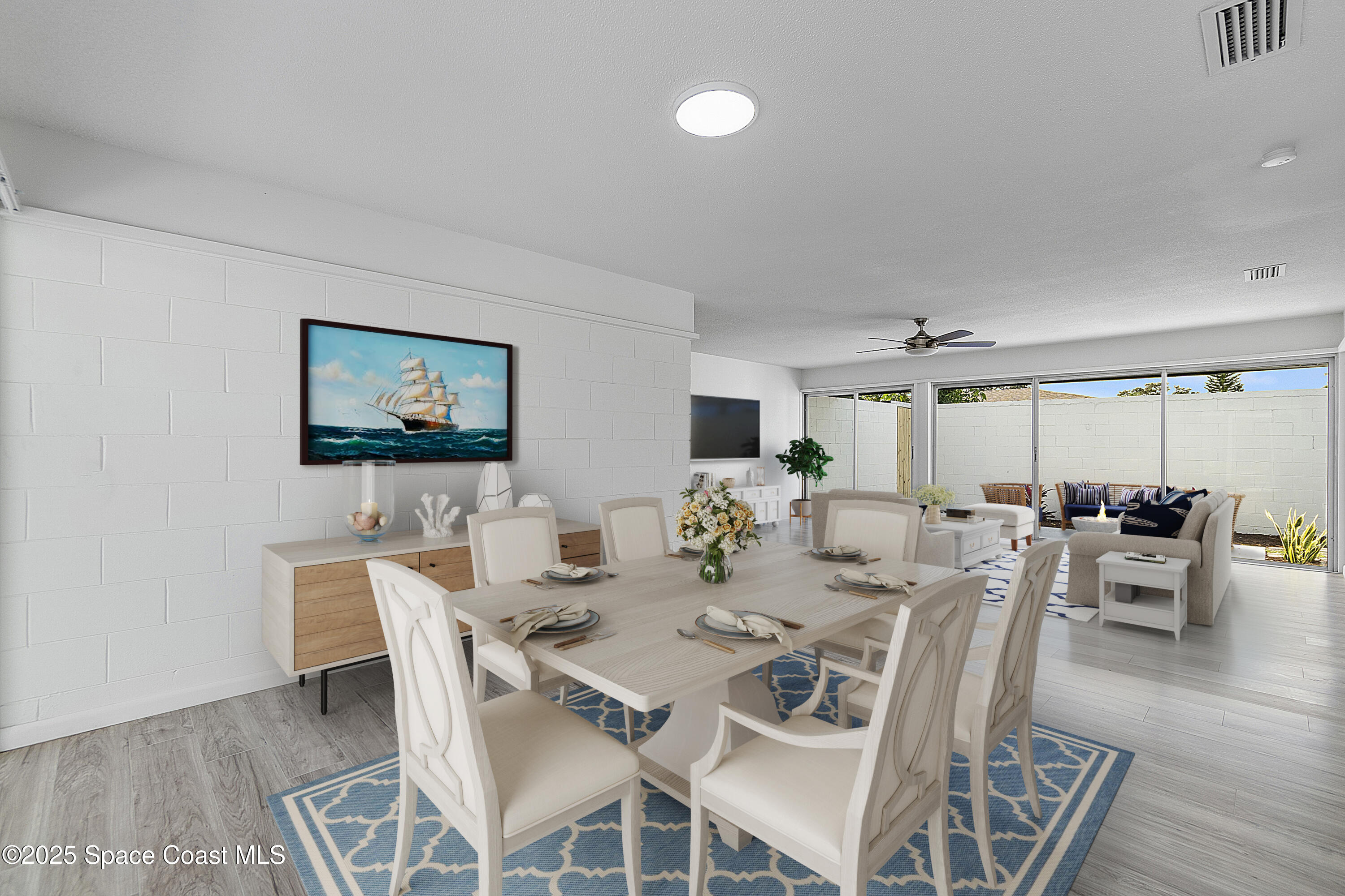 949 Levitt Parkway Rockledge, FL 32955 - Photo 28 of 52 a view of a dining room with furniture and wooden floor