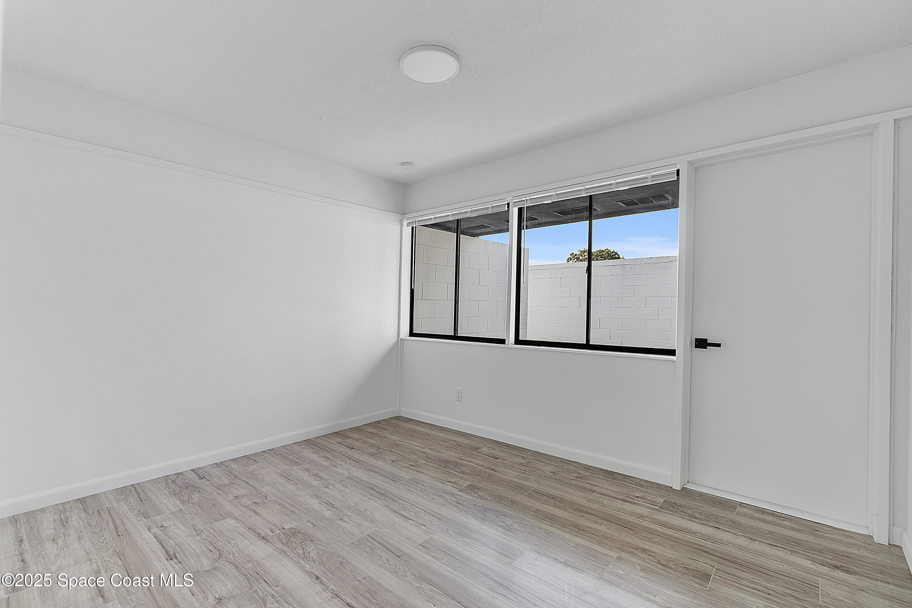 949 Levitt Parkway Rockledge, FL 32955 - Photo 33 of 52 wooden floor in an empty room