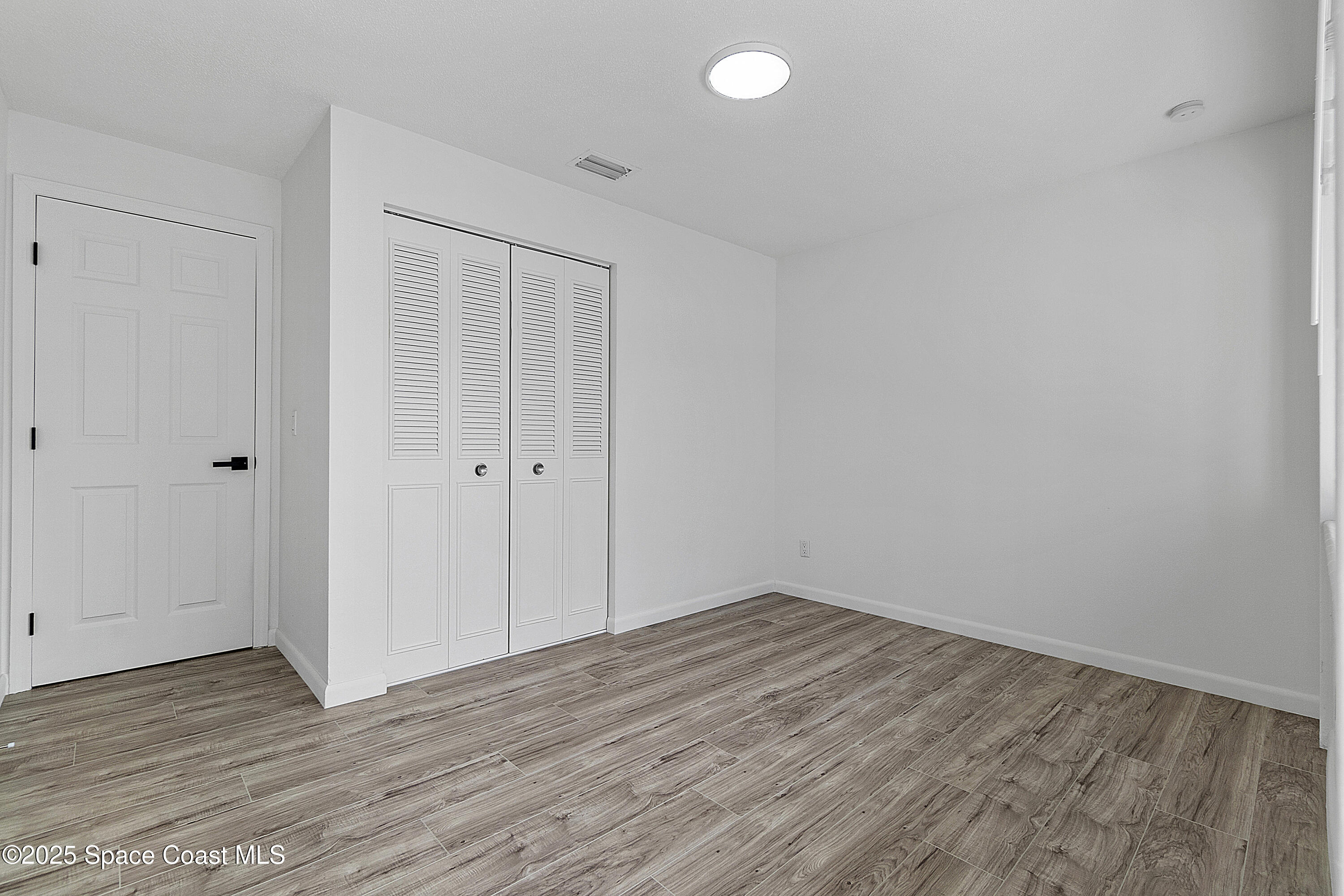 949 Levitt Parkway Rockledge, FL 32955 - Photo 38 of 52 a view of a room with wooden floor