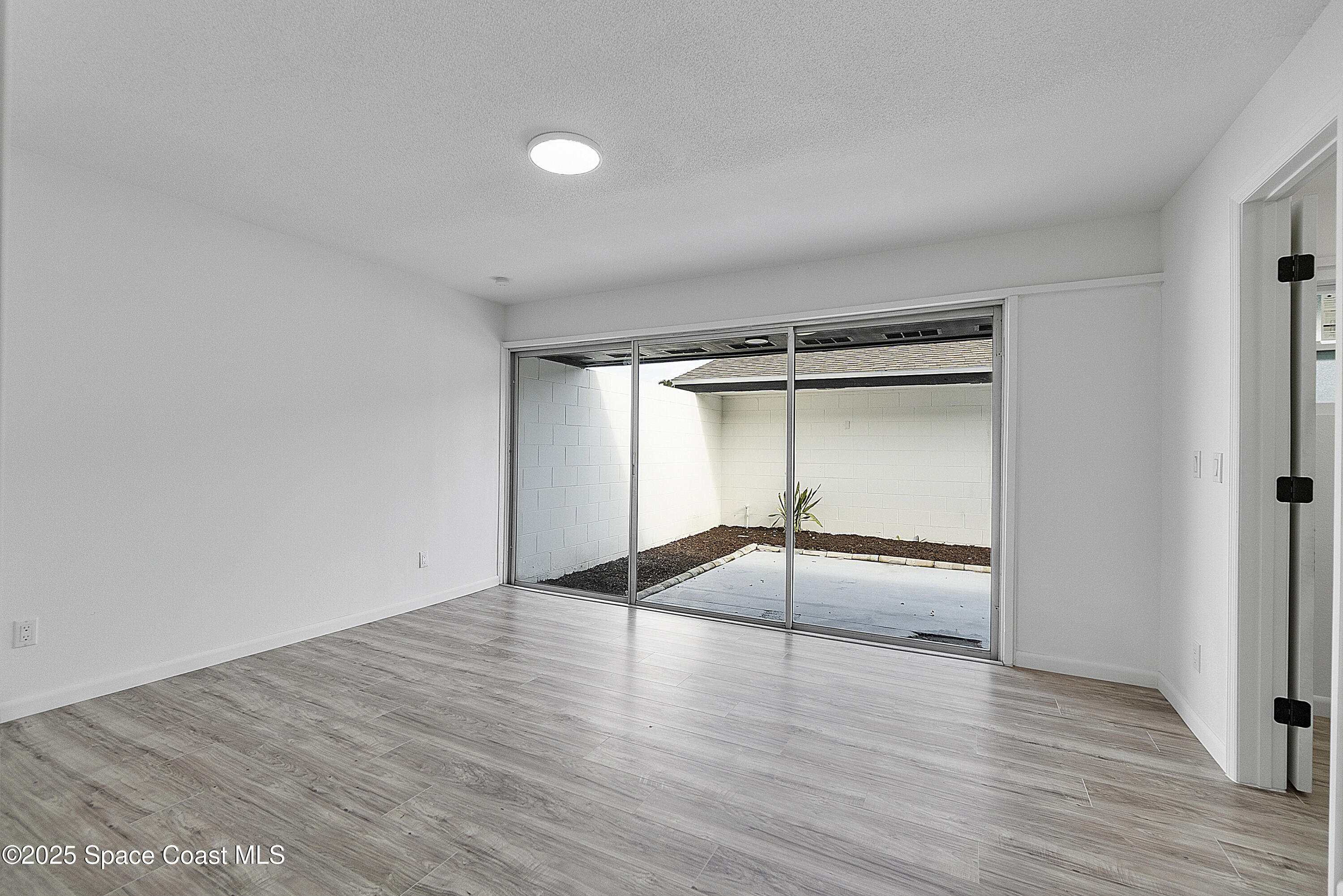 949 Levitt Parkway Rockledge, FL 32955 - Photo 40 of 52 wooden floor in an empty room with a empty space