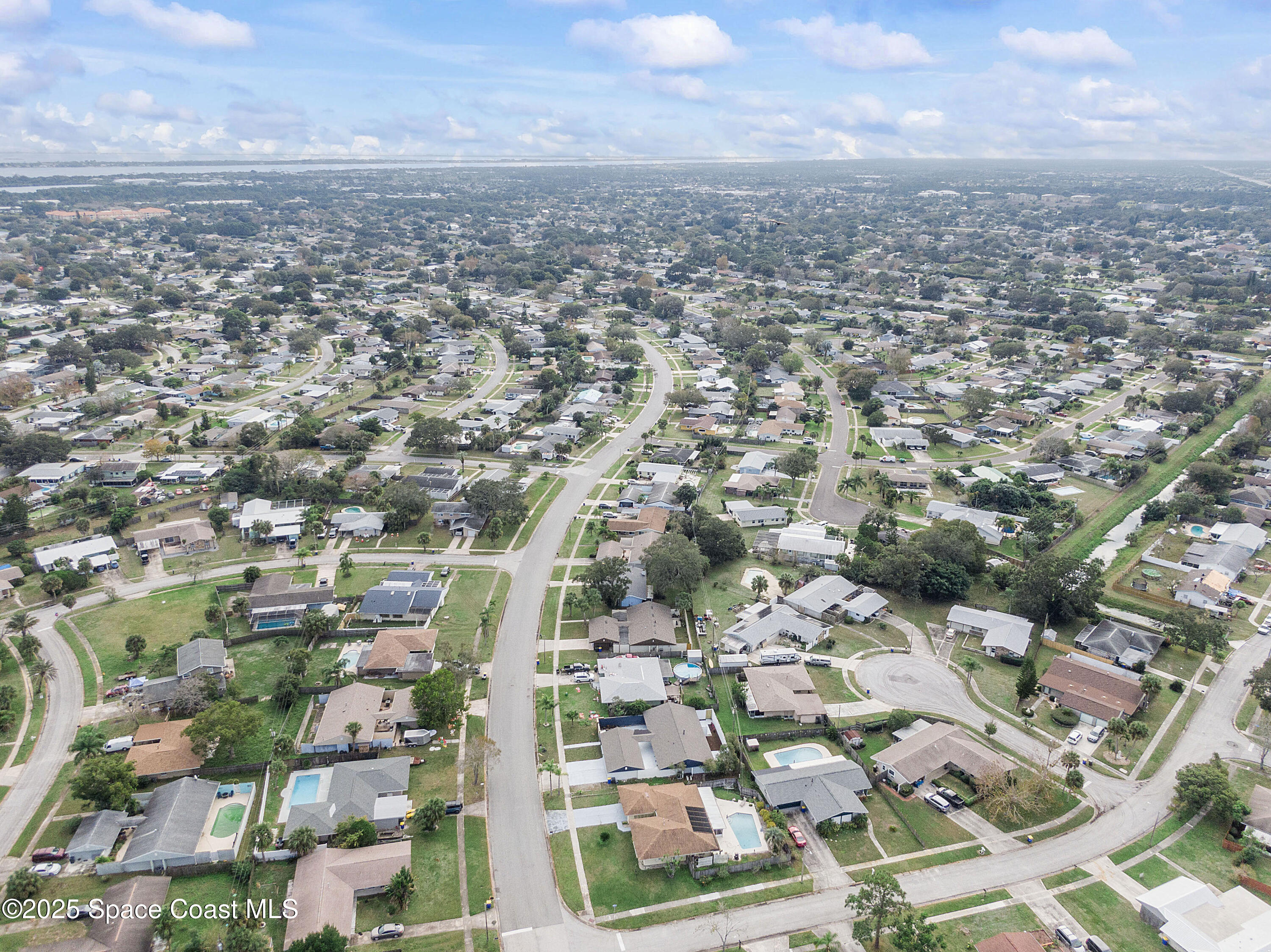 949 Levitt Parkway Rockledge, FL 32955 - Photo 4 of 52 an aerial view of residential houses with city view
