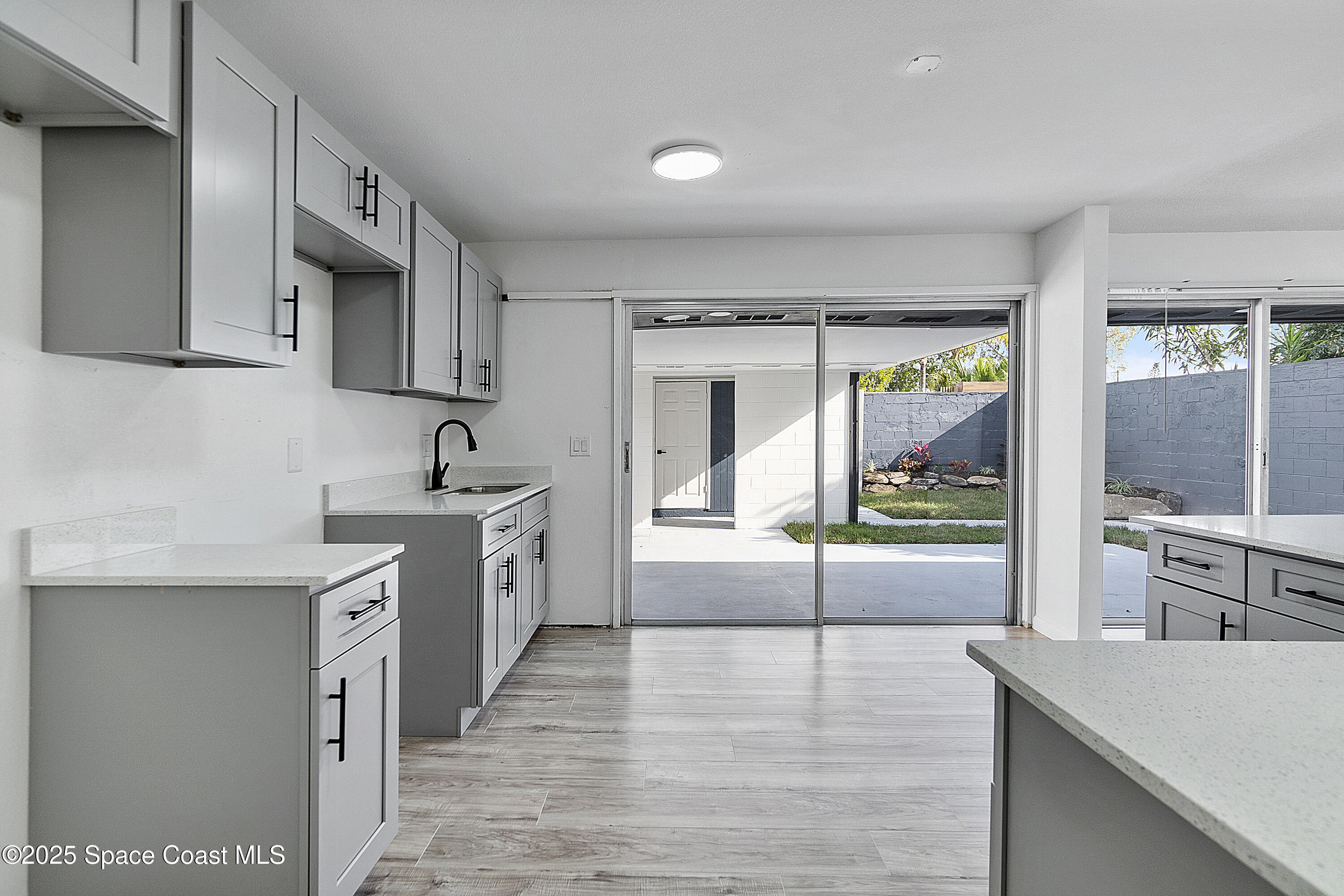 949 Levitt Parkway Rockledge, FL 32955 - Photo 45 of 52 a large white kitchen with a large window