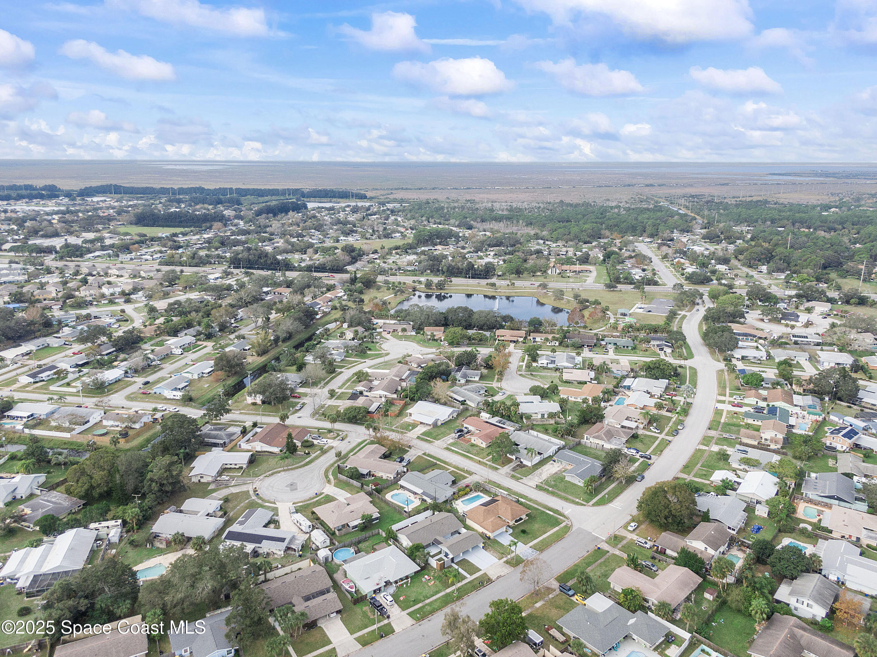 949 Levitt Parkway Rockledge, FL 32955 - Photo 6 of 52 an aerial view of residential building with green space