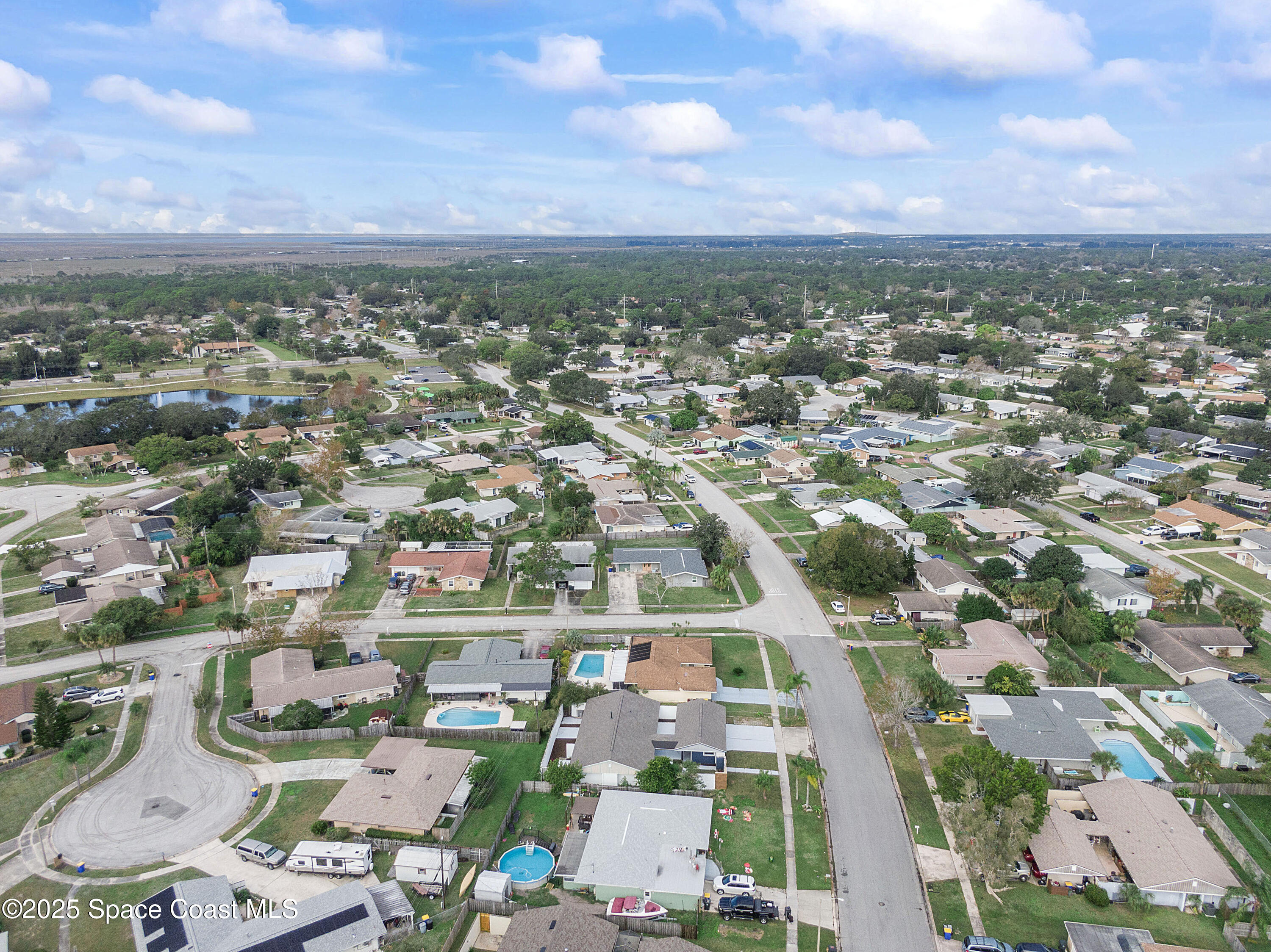 949 Levitt Parkway Rockledge, FL 32955 - Photo 7 of 52 an aerial view of residential houses with outdoor space