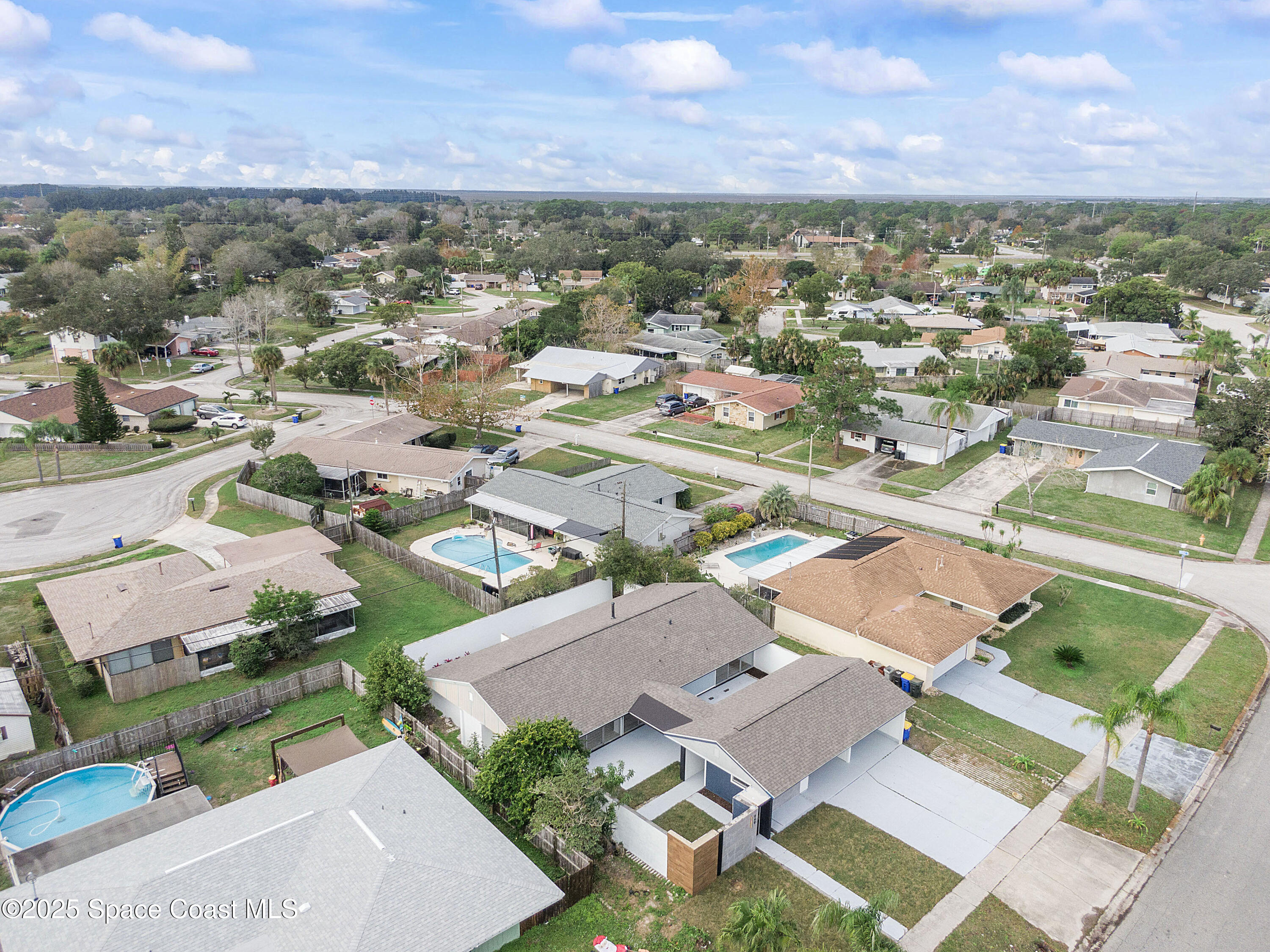 949 Levitt Parkway Rockledge, FL 32955 - Photo 8 of 52 an aerial view of residential houses with outdoor space
