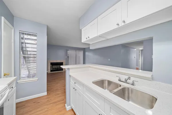 a kitchen with a sink and a window