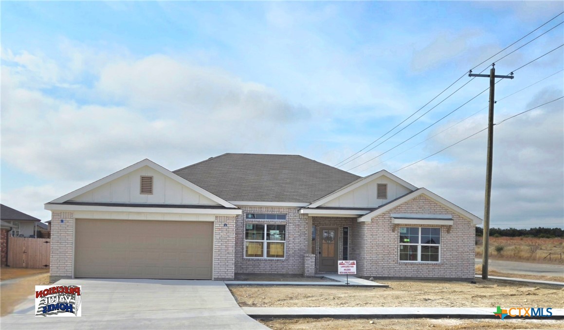 a front view of a house with garage