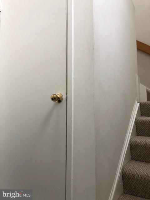 1961 Villaridge Drive, Unit B Reston, VA 20191 - Photo 20 of 21 downstairs closet and stairwell
