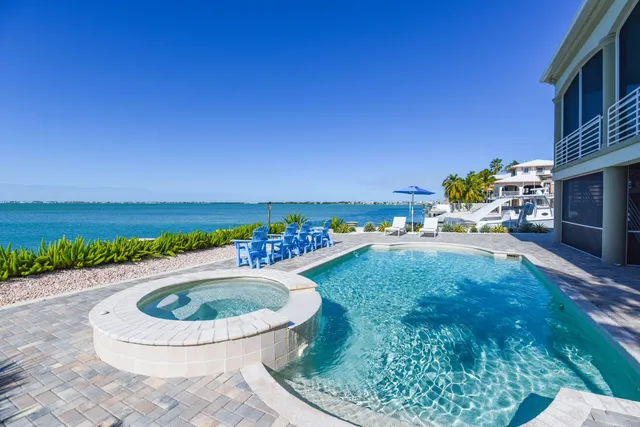 a view of a house with balcony and swimming pool