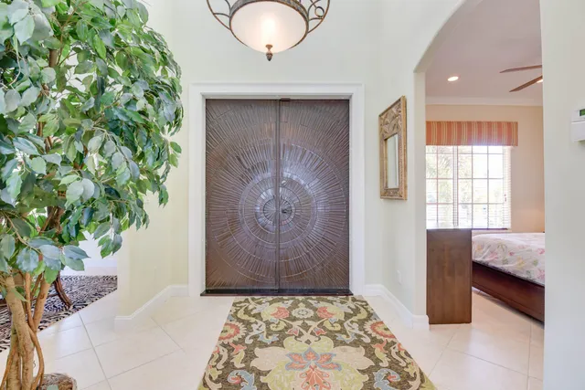 a kitchen with stainless steel appliances granite countertop a stove top oven a refrigerator cabinets and couches