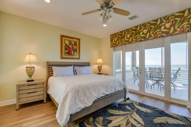 a utility room with stainless steel appliances granite countertop a sink and a cabinets