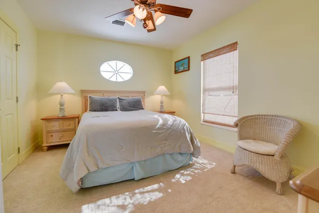 a living room with lots of furniture and a chandelier
