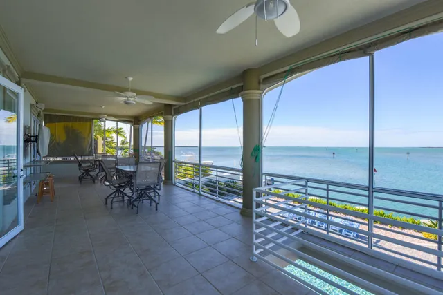 a swimming pool with outdoor seating and yard