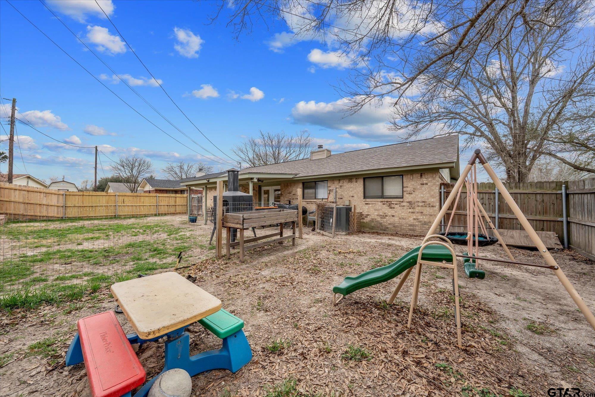 1105 Meadow Drive Athens, TX 75751 - Photo 21 of 23 a view of a house with backyard porch and sitting area