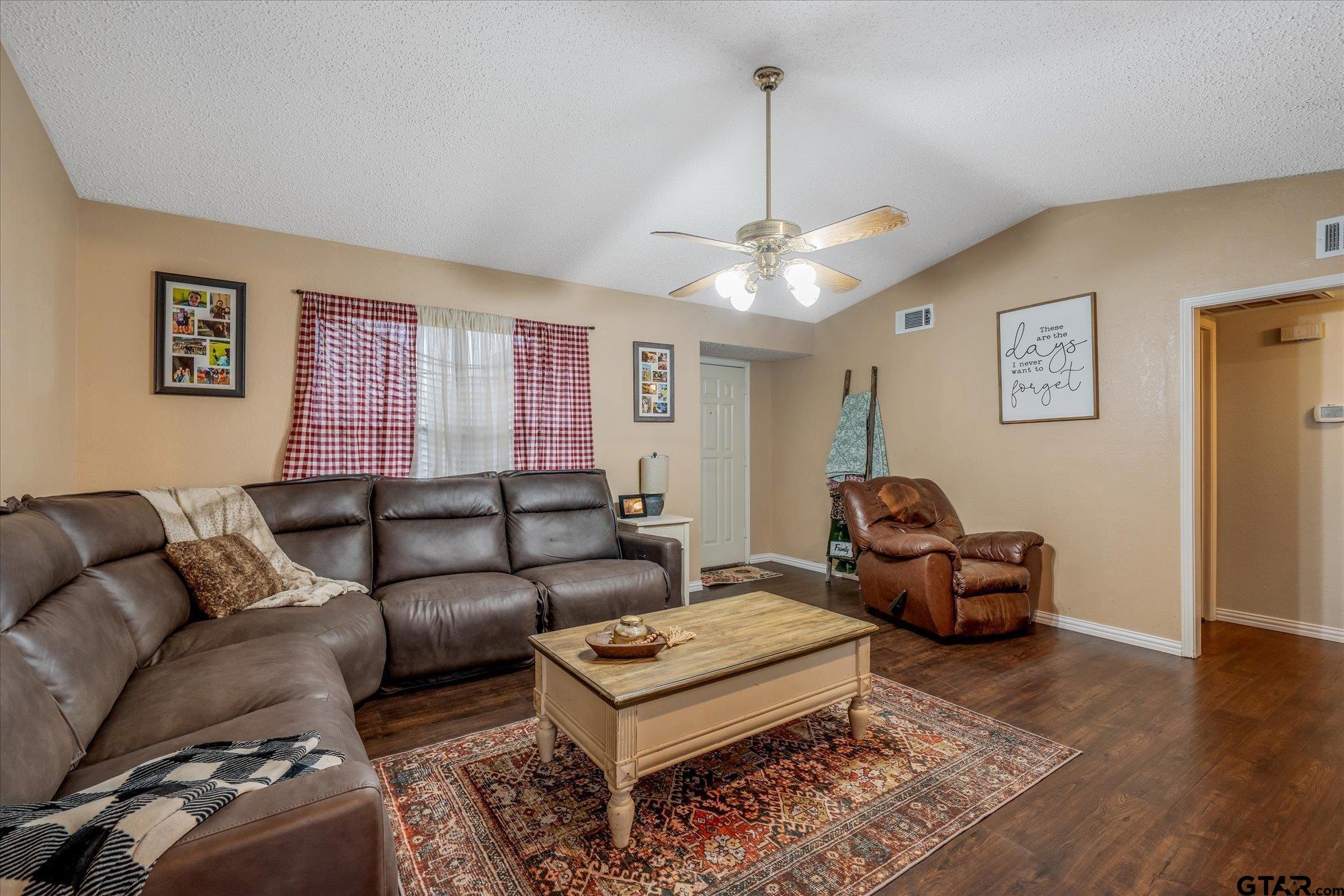 1105 Meadow Drive Athens, TX 75751 - Photo 5 of 23 a living room with furniture and a chandelier