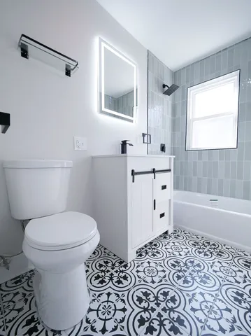 a bathroom with a toilet sink and a bathtub
