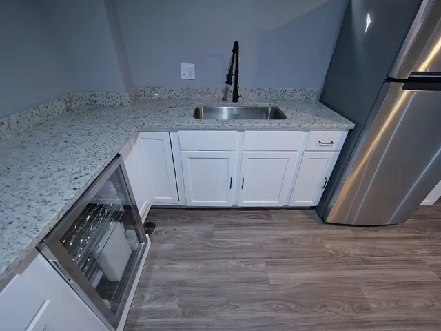 a kitchen with a sink and cabinets