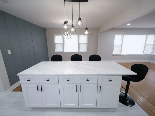 a view of kitchen with a ceiling fan
