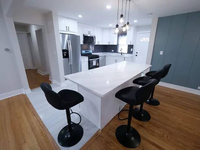 a view of kitchen and dining area with furniture