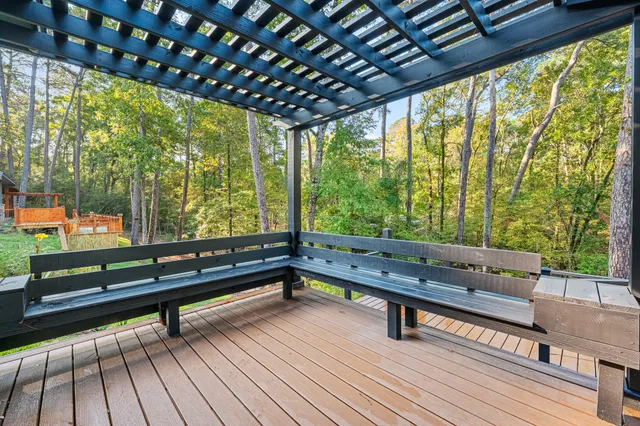a view of balcony with wooden floor and outdoor seating