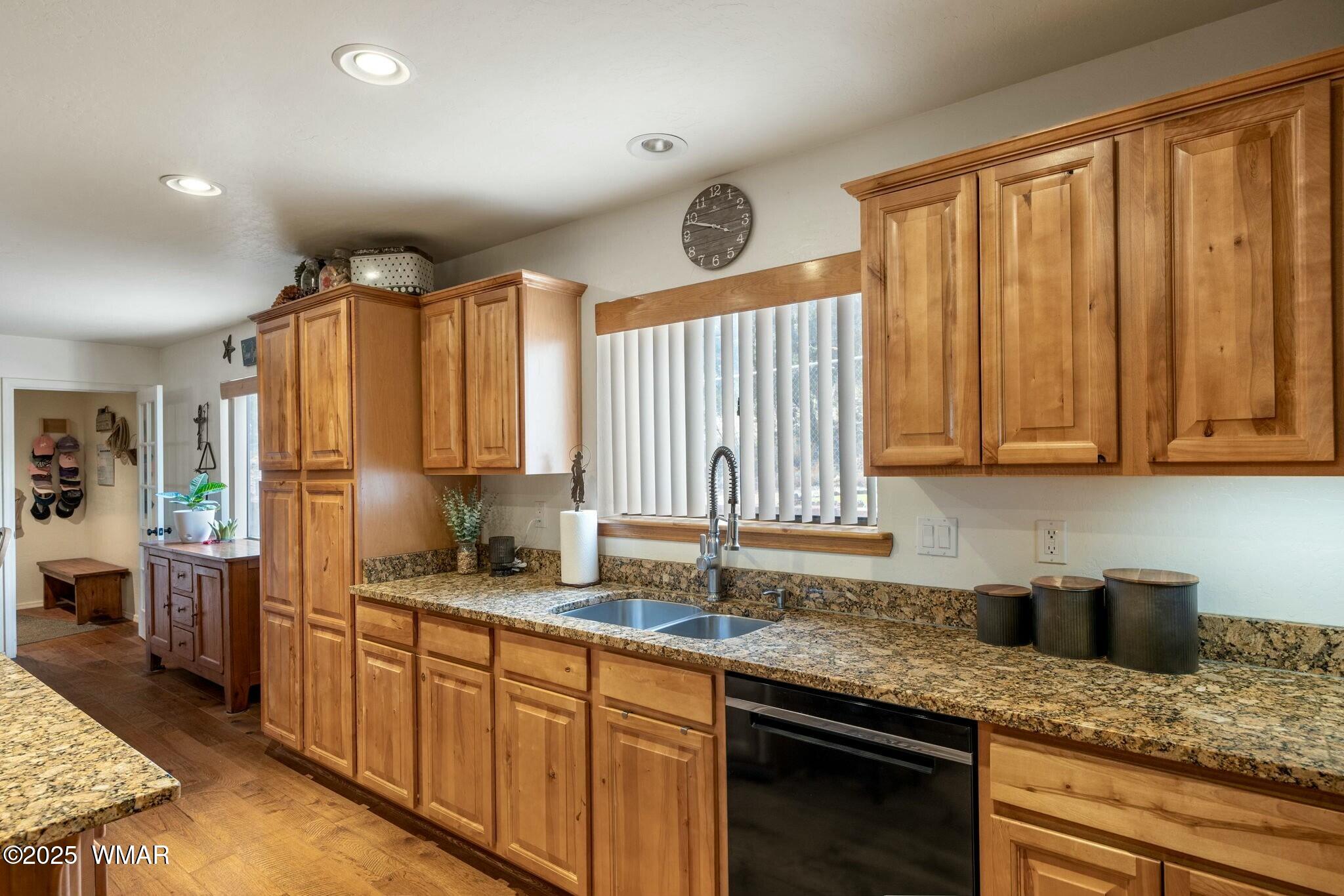 2938 Lodgepole Road Overgaard, AZ 85933 - Photo 15 of 43 a kitchen with stainless steel appliances granite countertop a sink a stove cabinets and a refrigerator