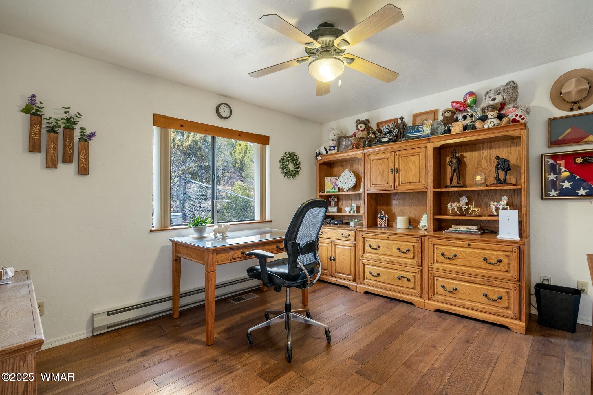2938 Lodgepole Road Overgaard, AZ 85933 - Photo 24 of 43 a view of a workspace with furniture and a window