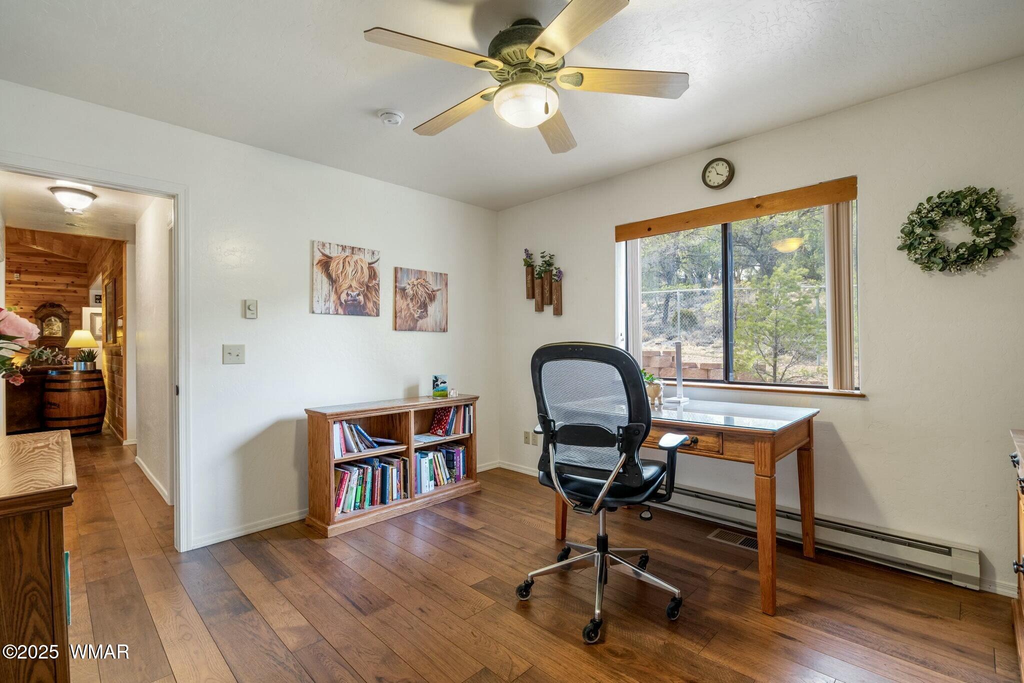 2938 Lodgepole Road Overgaard, AZ 85933 - Photo 25 of 43 a workspace with wooden floor and a workspace