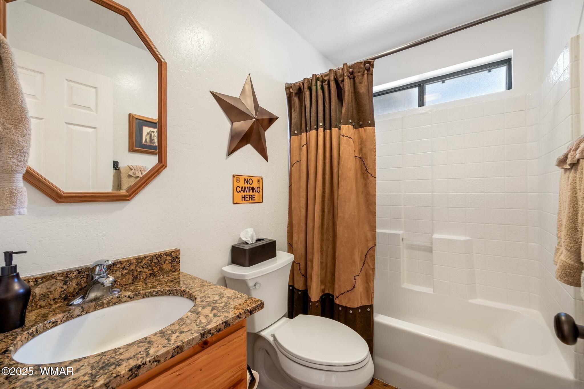2938 Lodgepole Road Overgaard, AZ 85933 - Photo 26 of 43 a bathroom with a granite countertop sink toilet and shower