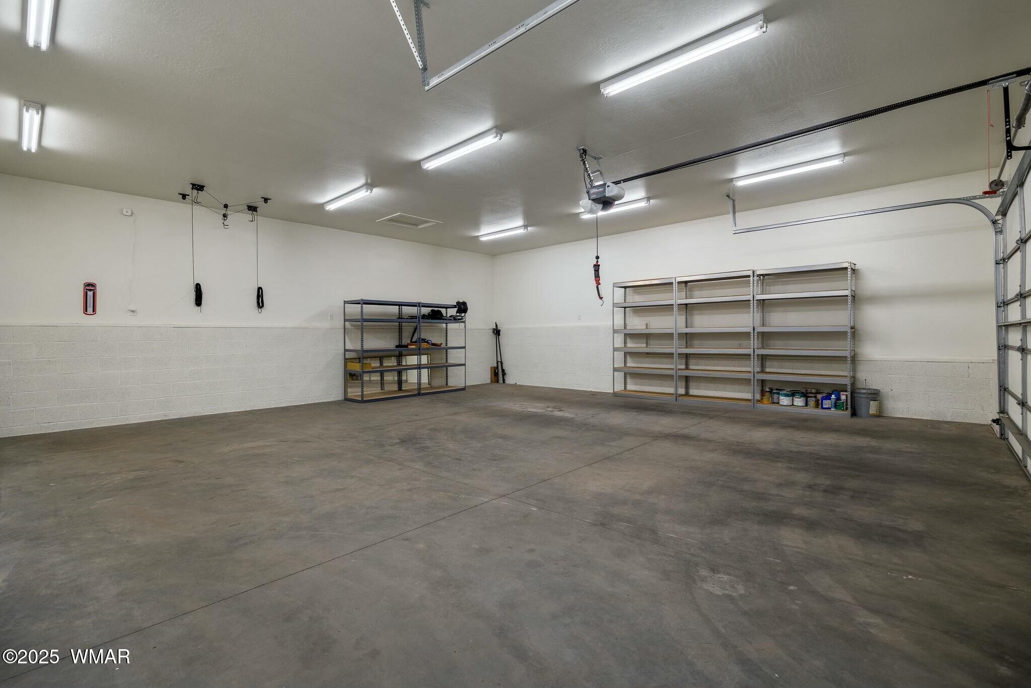 2938 Lodgepole Road Overgaard, AZ 85933 - Photo 35 of 43 a view of a garage room and a window