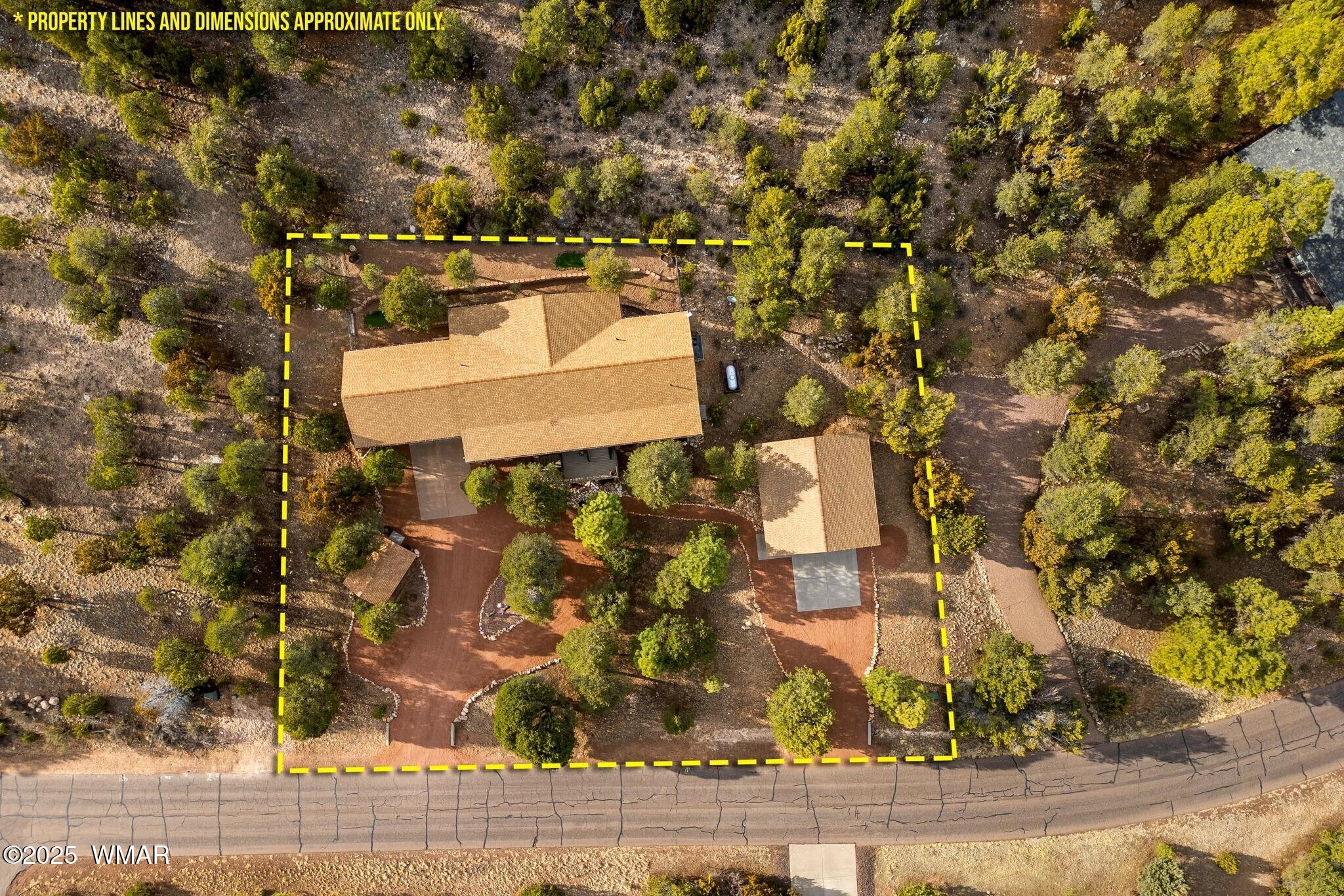 2938 Lodgepole Road Overgaard, AZ 85933 - Photo 41 of 43 front view of a house with a yard