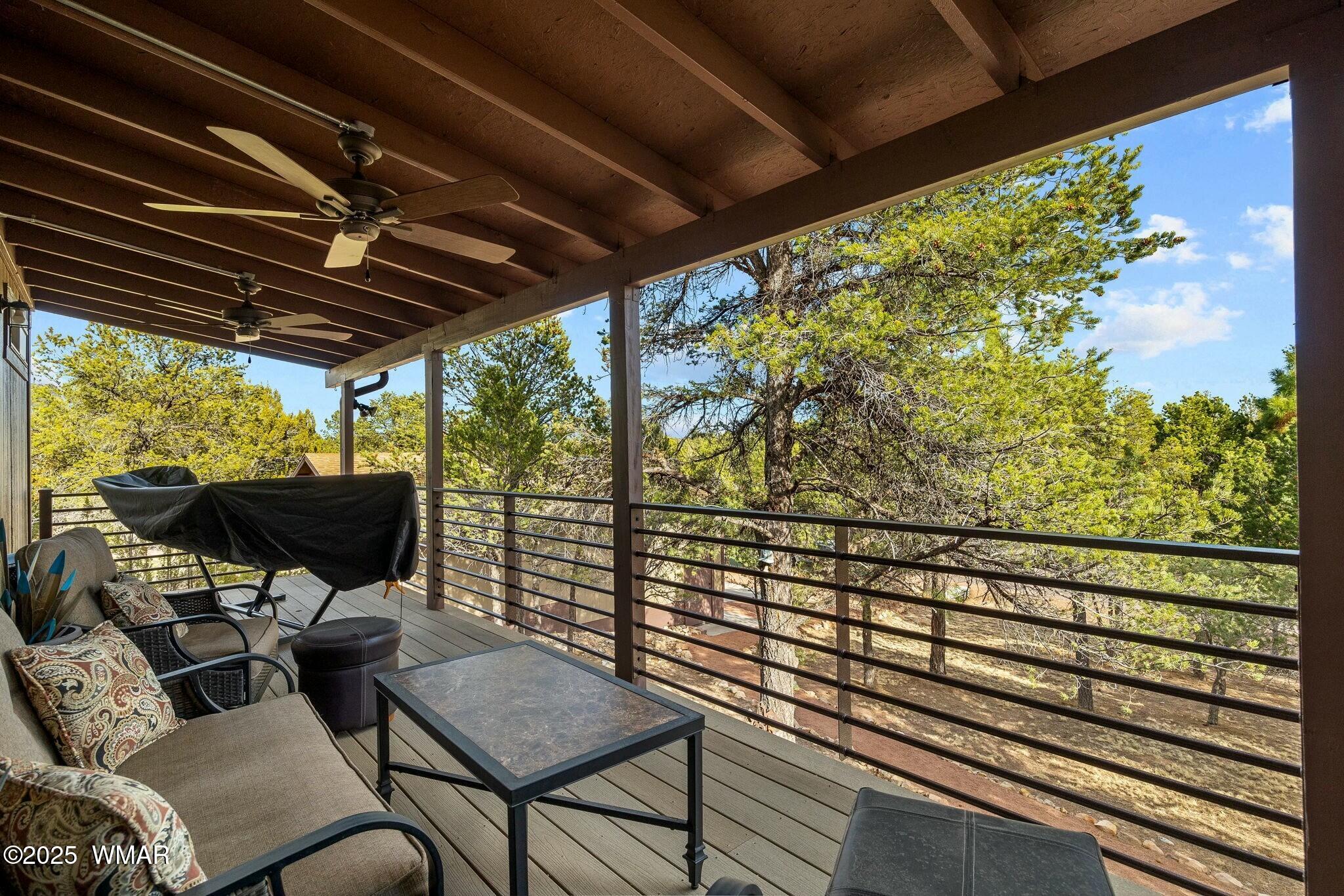 2938 Lodgepole Road Overgaard, AZ 85933 - Photo 6 of 43 a view of a chairs and table in the balcony