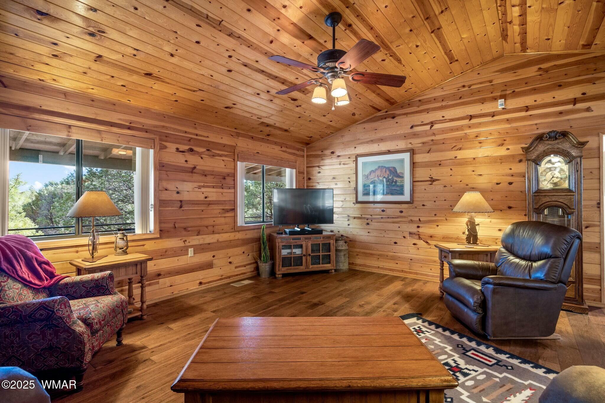 2938 Lodgepole Road Overgaard, AZ 85933 - Photo 9 of 43 a living room with furniture and wooden floor