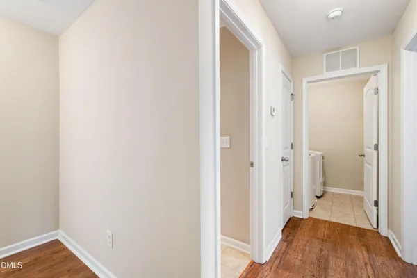 a view of a bedroom from a hallway
