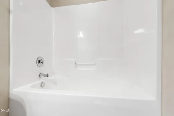 a bathroom with a white bath tub