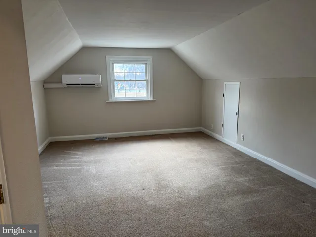 an empty room with a kitchen